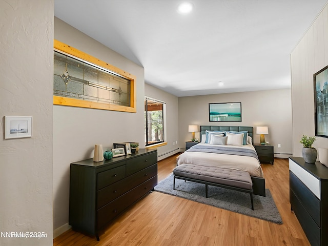 315 Paiute Dr, Zephyr Cove, NV 89448 - bedroom with a baseboard heating unit, wood finished floors, and recessed lighting