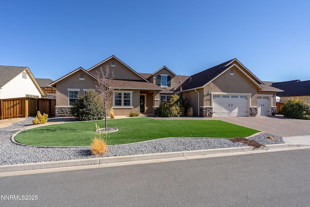 11760 Valley Crest Dr, Sparks, NV 89441 - view of front of house with stone siding, stucco siding, and an attached garage