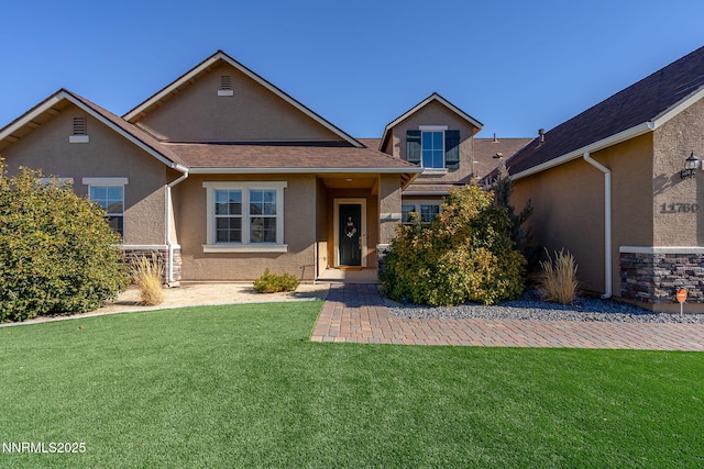 11760 Valley Crest Dr, Sparks, NV 89441 - traditional home featuring stucco siding, a front lawn, roof with shingles, and stone siding