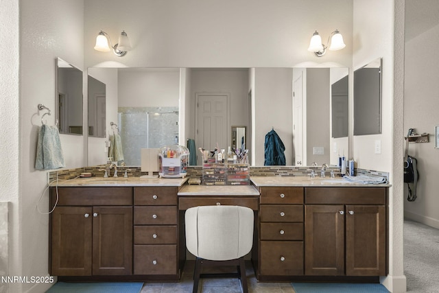 11760 Valley Crest Dr, Sparks, NV 89441 - bathroom featuring a tile shower, vanity, and baseboards