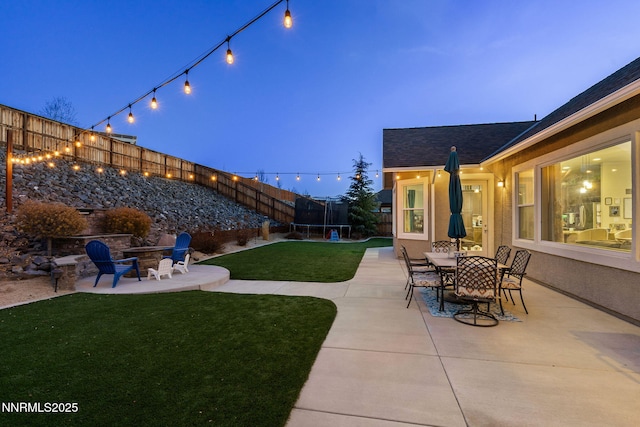 11760 Valley Crest Dr, Sparks, NV 89441 - view of yard featuring a trampoline, a patio area, and an outdoor fire pit