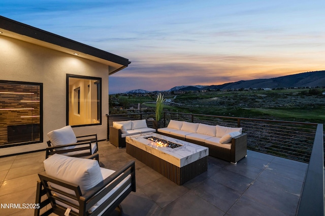 3041 Palmer Pointe Ct, Reno, NV 89511 - view of patio featuring an outdoor living space with a fire pit and a mountain view