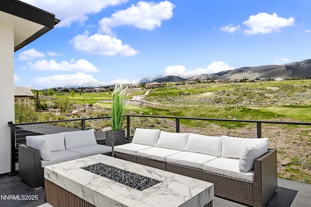 3041 Palmer Pointe Ct, Reno, NV 89511 - view of patio / terrace with a mountain view, an outdoor living space with a fire pit, and a balcony