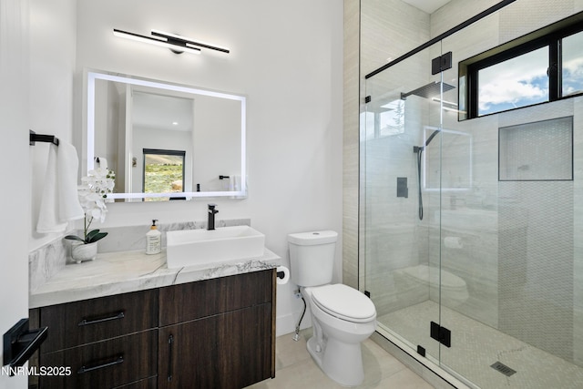 3041 Palmer Pointe Ct, Reno, NV 89511 - bathroom featuring toilet, vanity, a shower stall, and tile patterned floors