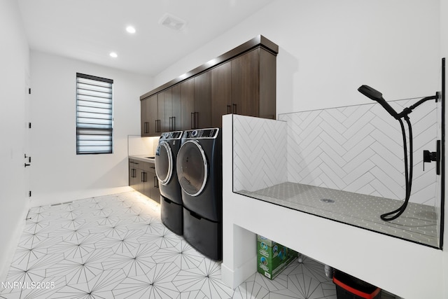 3041 Palmer Pointe Ct, Reno, NV 89511 - laundry room with cabinet space, washing machine and clothes dryer, recessed lighting, and baseboards