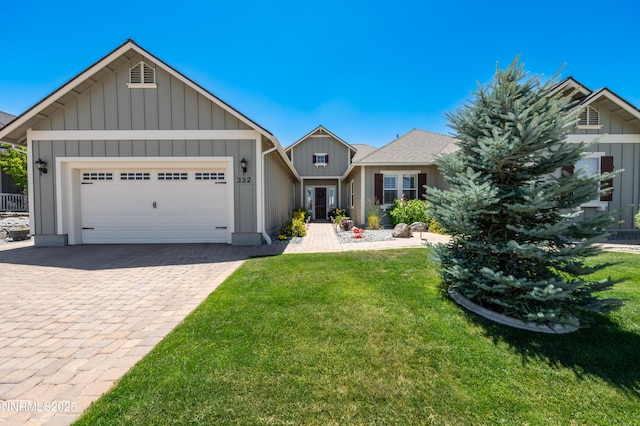 332 Blooming Sage Way, Spanish Springs, NV 89441 - view of front of house with board and batten siding, a garage, a front lawn, and driveway