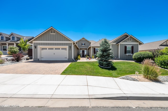 332 Blooming Sage Way, Spanish Springs, NV 89441 - view of front facade featuring decorative driveway, a garage, a front yard, and board and batten siding