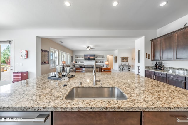 332 Blooming Sage Way, Spanish Springs, NV 89441 - kitchen featuring dark brown cabinetry, open floor plan, light stone countertops, recessed lighting, and stainless steel dishwasher
