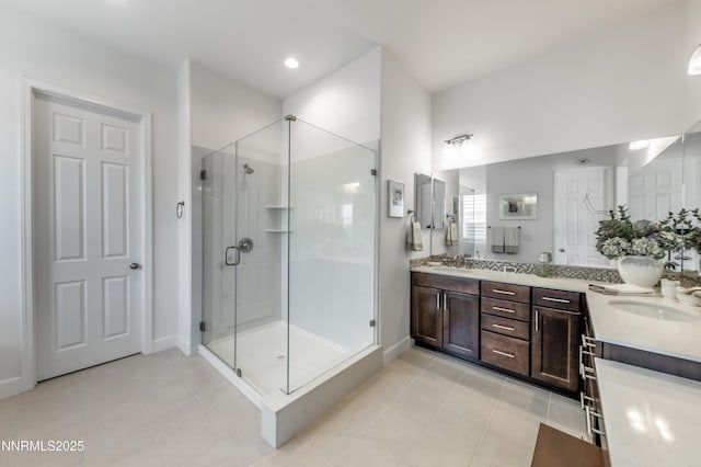 332 Blooming Sage Way, Spanish Springs, NV 89441 - bathroom featuring double vanity, a shower stall, and tile patterned floors