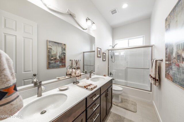 332 Blooming Sage Way, Spanish Springs, NV 89441 - full bathroom with double vanity, enclosed tub / shower combo, and tile patterned floors