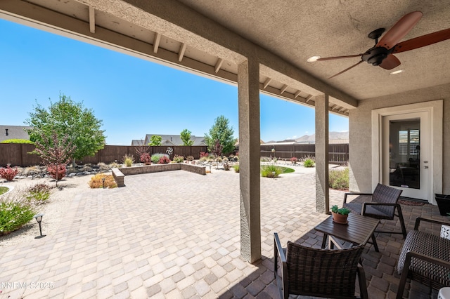 332 Blooming Sage Way, Spanish Springs, NV 89441 - fenced backyard with ceiling fan and a patio