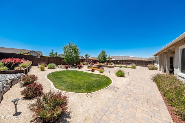 332 Blooming Sage Way, Spanish Springs, NV 89441 - fenced backyard featuring a patio area