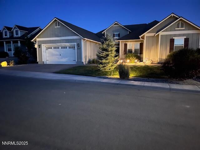 332 Blooming Sage Way, Spanish Springs, NV 89441 - single story home featuring board and batten siding, a garage, and driveway