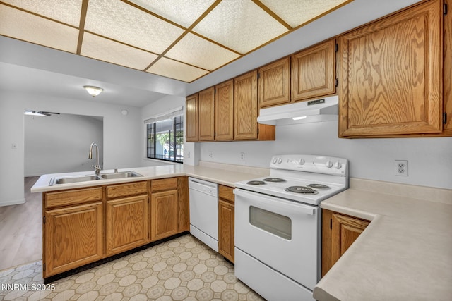 3803 Imperial Way, Carson City, NV 89706 - kitchen featuring white appliances, under cabinet range hood, a sink, and light countertops