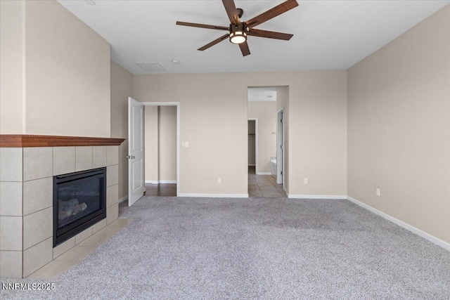 5345 Energystone Dr, Sparks, NV 89436 - unfurnished living room featuring ceiling fan, a tiled fireplace, and light carpet