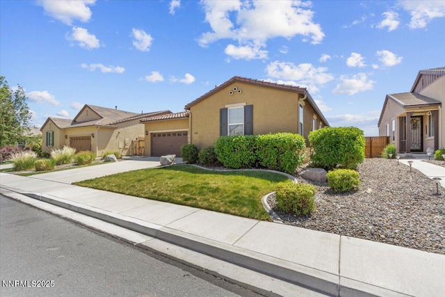 5345 Energystone Dr, Sparks, NV 89436 - mediterranean / spanish home with a garage, driveway, stucco siding, and a tiled roof
