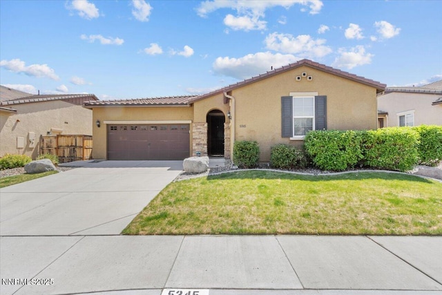 5345 Energystone Dr, Sparks, NV 89436 - mediterranean / spanish home with concrete driveway, an attached garage, stucco siding, and a tiled roof