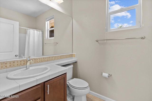 5345 Energystone Dr, Sparks, NV 89436 - full bath with vanity, tasteful backsplash, curtained shower, and tile patterned floors