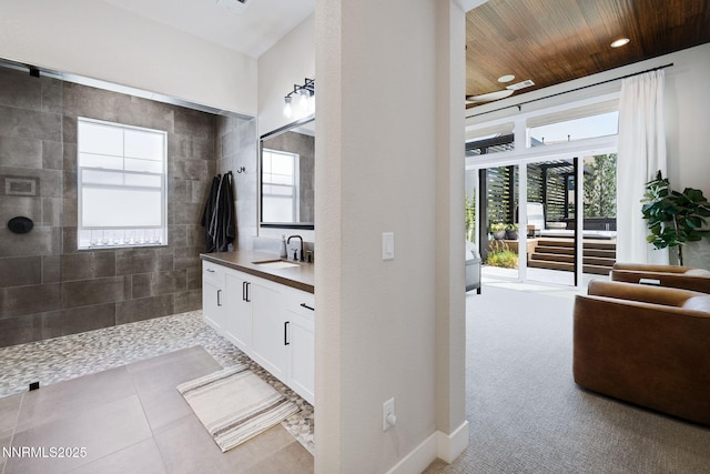 208 Criollo Ct, Reno, NV 89511 - bathroom featuring vanity, a walk in shower, wooden ceiling, recessed lighting, and baseboards