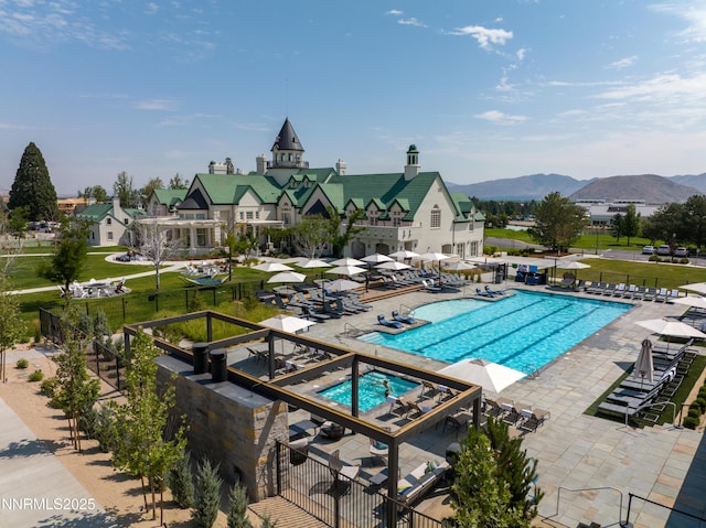 208 Criollo Ct, Reno, NV 89511 - community pool with a patio area and a mountain view
