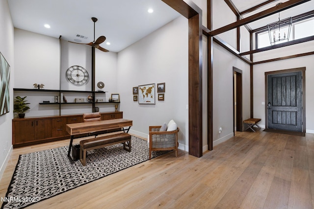 208 Criollo Ct, Reno, NV 89511 - entrance foyer with a chandelier, a high ceiling, light wood finished floors, baseboards, and recessed lighting