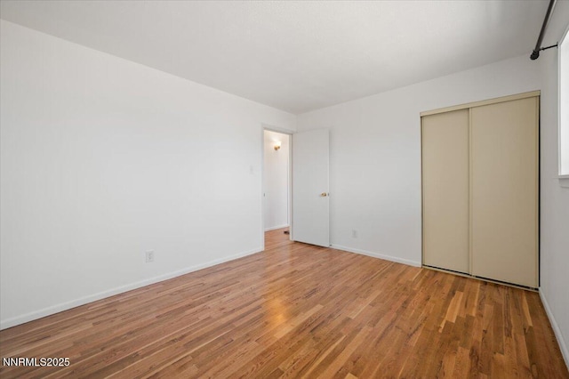 664 Beldon Way, Reno, NV 89503 - unfurnished bedroom with light wood-style floors, baseboards, and a closet