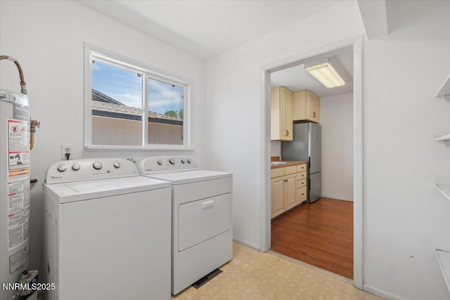 664 Beldon Way, Reno, NV 89503 - washroom with light flooring, gas water heater, and washer and clothes dryer