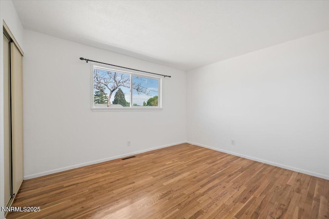 664 Beldon Way, Reno, NV 89503 - unfurnished bedroom with light wood-type flooring, a closet, and baseboards