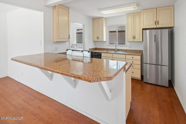 664 Beldon Way, Reno, NV 89503 - kitchen featuring freestanding refrigerator, cream cabinets, a sink, and dishwasher