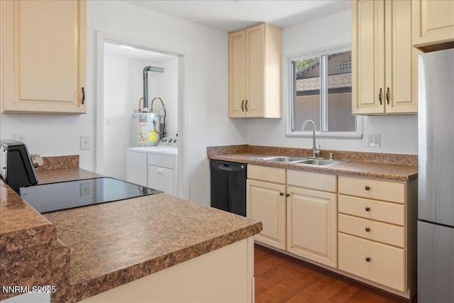 664 Beldon Way, Reno, NV 89503 - kitchen featuring cream cabinetry, dishwasher, a sink, freestanding refrigerator, and washing machine and clothes dryer