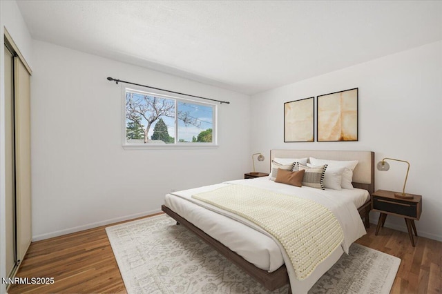 664 Beldon Way, Reno, NV 89503 - bedroom featuring wood finished floors, a closet, and baseboards