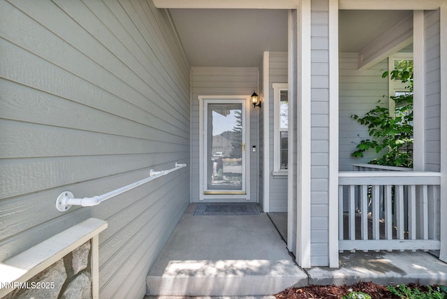 9951 Grand Falls Dr, Reno, NV 89506 - doorway to property featuring covered porch