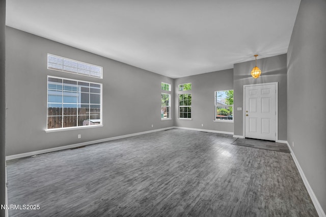 9951 Grand Falls Dr, Reno, NV 89506 - unfurnished room featuring dark wood-style flooring and baseboards