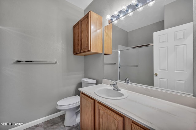 9951 Grand Falls Dr, Reno, NV 89506 - bathroom featuring an enclosed shower, vanity, toilet, and baseboards