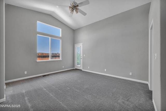 9951 Grand Falls Dr, Reno, NV 89506 - empty room featuring ceiling fan, healthy amount of natural light, dark colored carpet, high vaulted ceiling, and baseboards