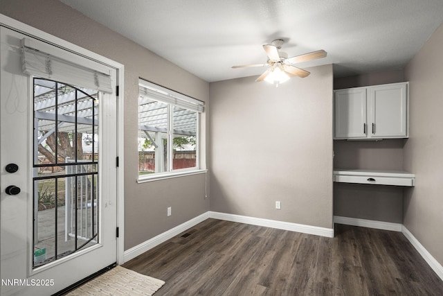15 Sunlit Ct, Sparks, NV 89441 - unfurnished dining area with dark wood finished floors, ceiling fan, and baseboards
