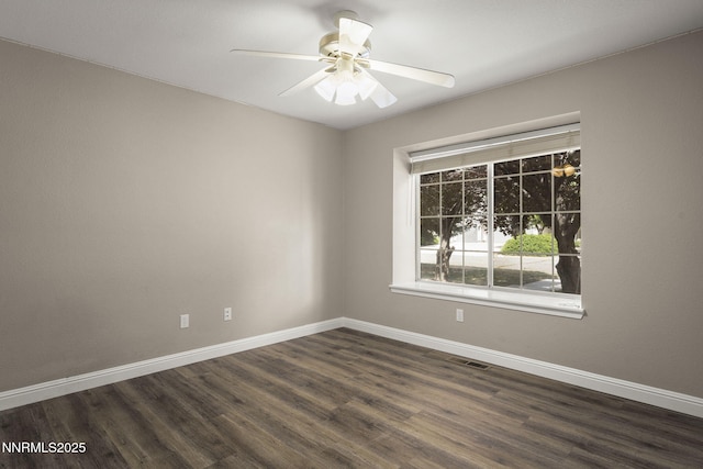 15 Sunlit Ct, Sparks, NV 89441 - spare room featuring dark wood-style flooring, baseboards, and a ceiling fan