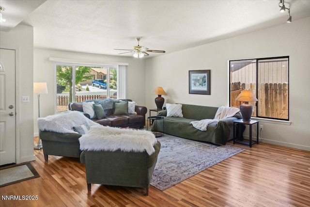 806 Bluerock Rd, Gardnerville, NV 89460 - living room featuring wood finished floors, ceiling fan, and baseboards