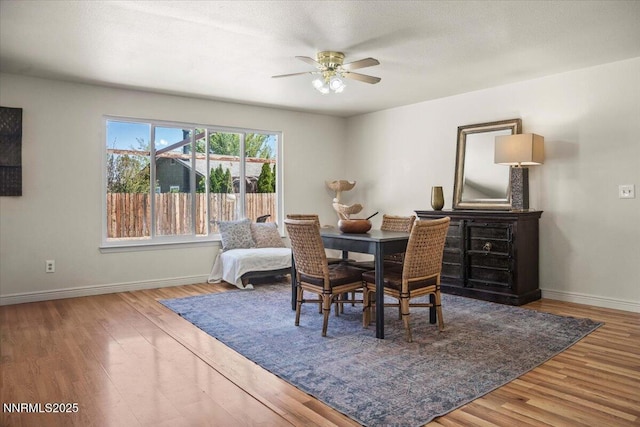 806 Bluerock Rd, Gardnerville, NV 89460 - dining space with a ceiling fan, baseboards, and wood finished floors