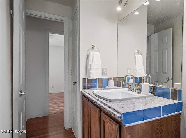 806 Bluerock Rd, Gardnerville, NV 89460 - bathroom with vanity, wood finished floors, and baseboards