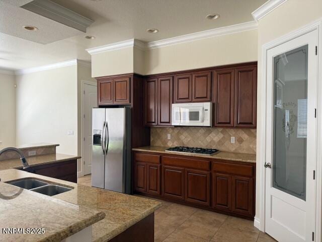 1313 Cedar Creek Cir, Gardnerville, NV 89460 - kitchen featuring appliances with stainless steel finishes, crown molding, tasteful backsplash, light tile patterned floors, and recessed lighting
