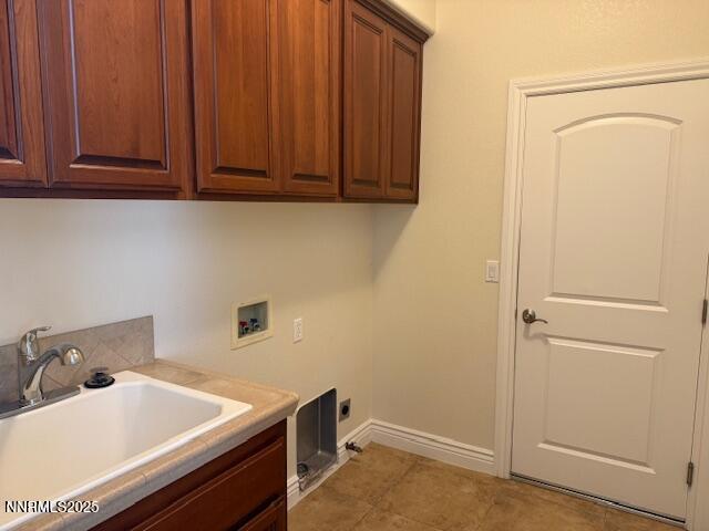 1313 Cedar Creek Cir, Gardnerville, NV 89460 - laundry room with cabinet space, hookup for a washing machine, and electric dryer hookup