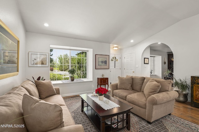 13450 Evening Song Ln, Reno, NV 89511 - living area featuring wood finished floors, arched walkways, lofted ceiling, and recessed lighting