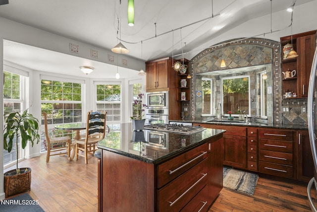 13450 Evening Song Ln, Reno, NV 89511 - kitchen with a sink, stainless steel appliances, open shelves, dark wood-style floors, and plenty of natural light