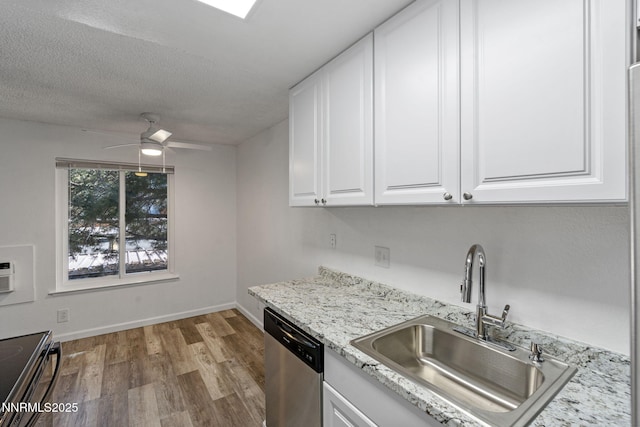 4608 Neil Rd Unit 226, Reno, NV 89502 - kitchen with stainless steel dishwasher, a sink, light wood-type flooring, ceiling fan, and white cabinets