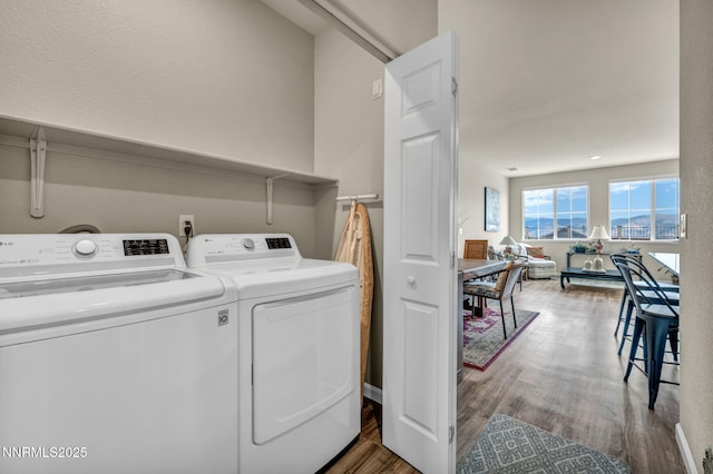 14206 Tuscan Sun Ct, Reno, NV 89511 - washroom featuring independent washer and dryer and wood finished floors