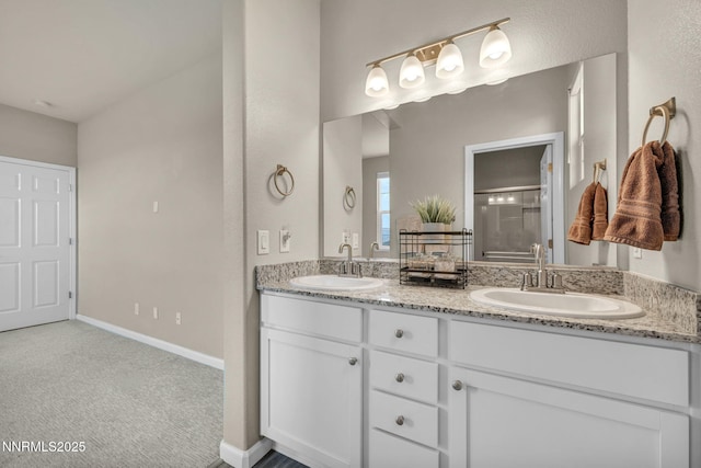 14206 Tuscan Sun Ct, Reno, NV 89511 - bathroom featuring double vanity and a shower with shower door