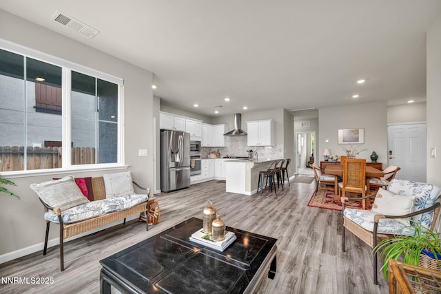 14206 Tuscan Sun Ct, Reno, NV 89511 - living room featuring light wood-style floors and recessed lighting