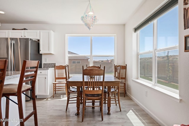 1318 Serenity Cir, Fernley, NV 89408 - dining space featuring healthy amount of natural light, light wood-style floors, and baseboards