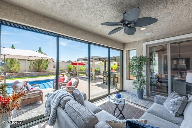 504 Alpine Rose Ct, Reno, NV 89521 - sunroom featuring an outdoor living space, ceiling fan, and healthy amount of natural light